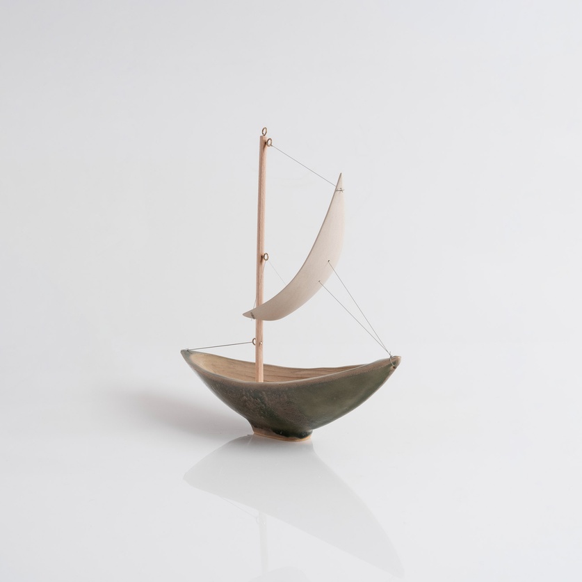 Olive-colored ceramic sailboat