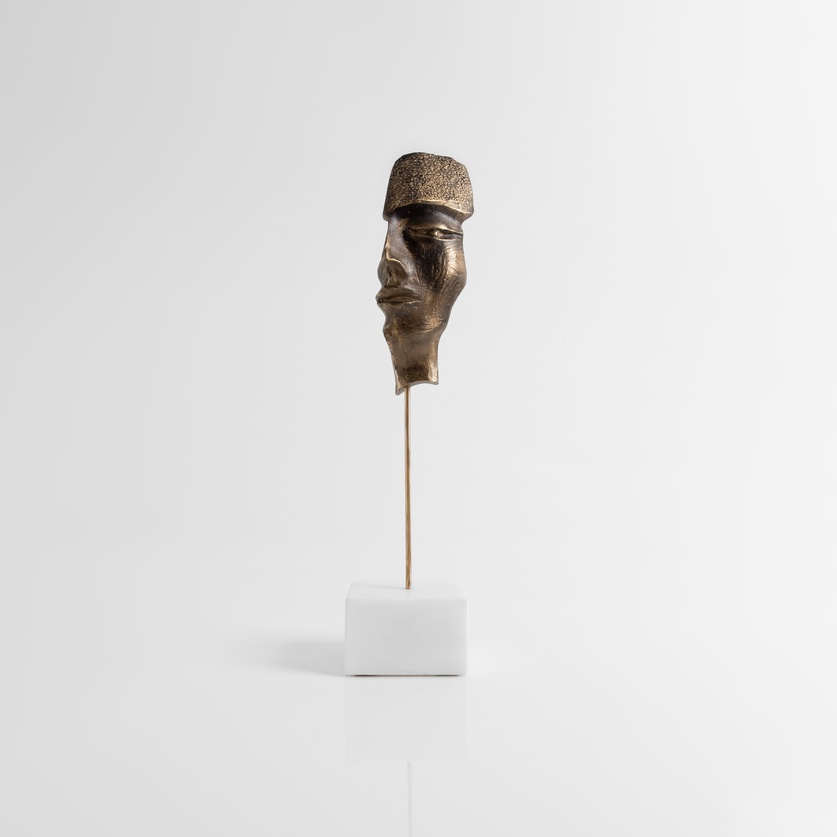 Bronze mask-sculpture on a marble base