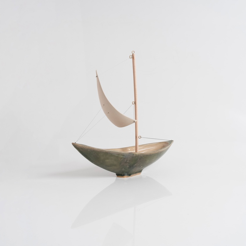 Olive-colored ceramic sailboat