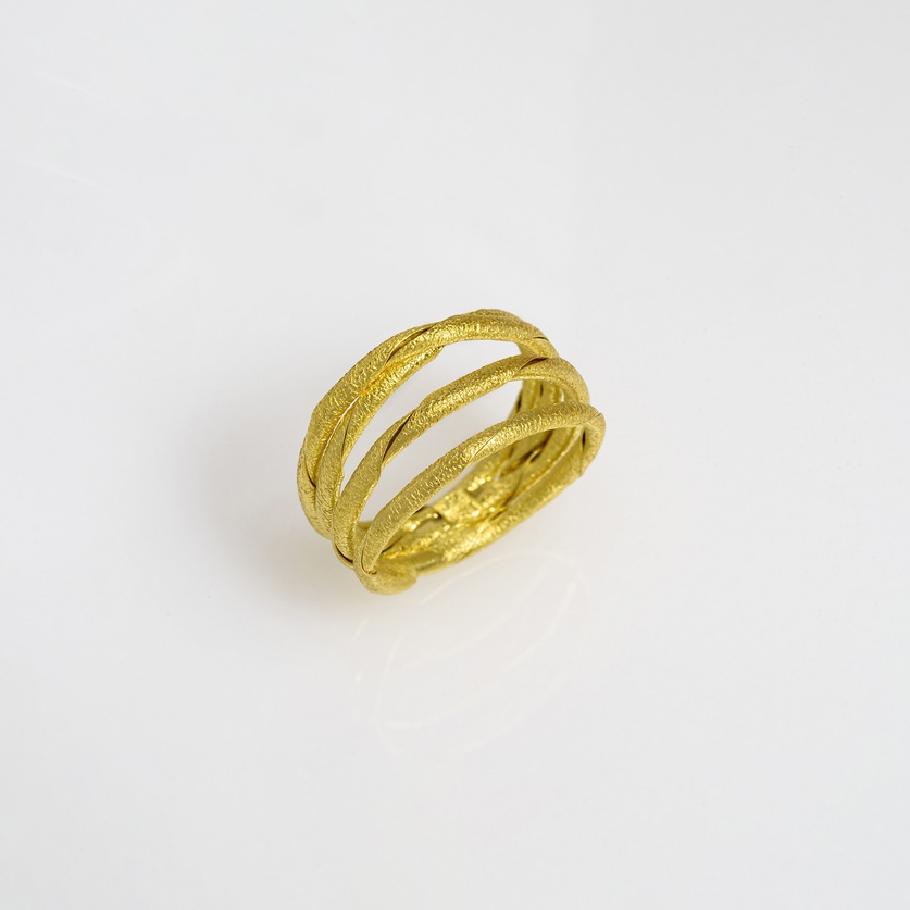 Beautiful gold ring in chenier technique