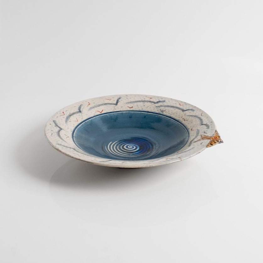 Blue ceramic platter with a little bird