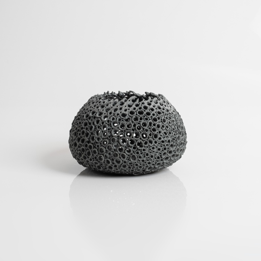 Black perforated candle holder