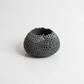 Black perforated candle holder