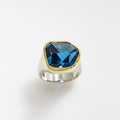 Impressive ring in silver and gold with blue topaz