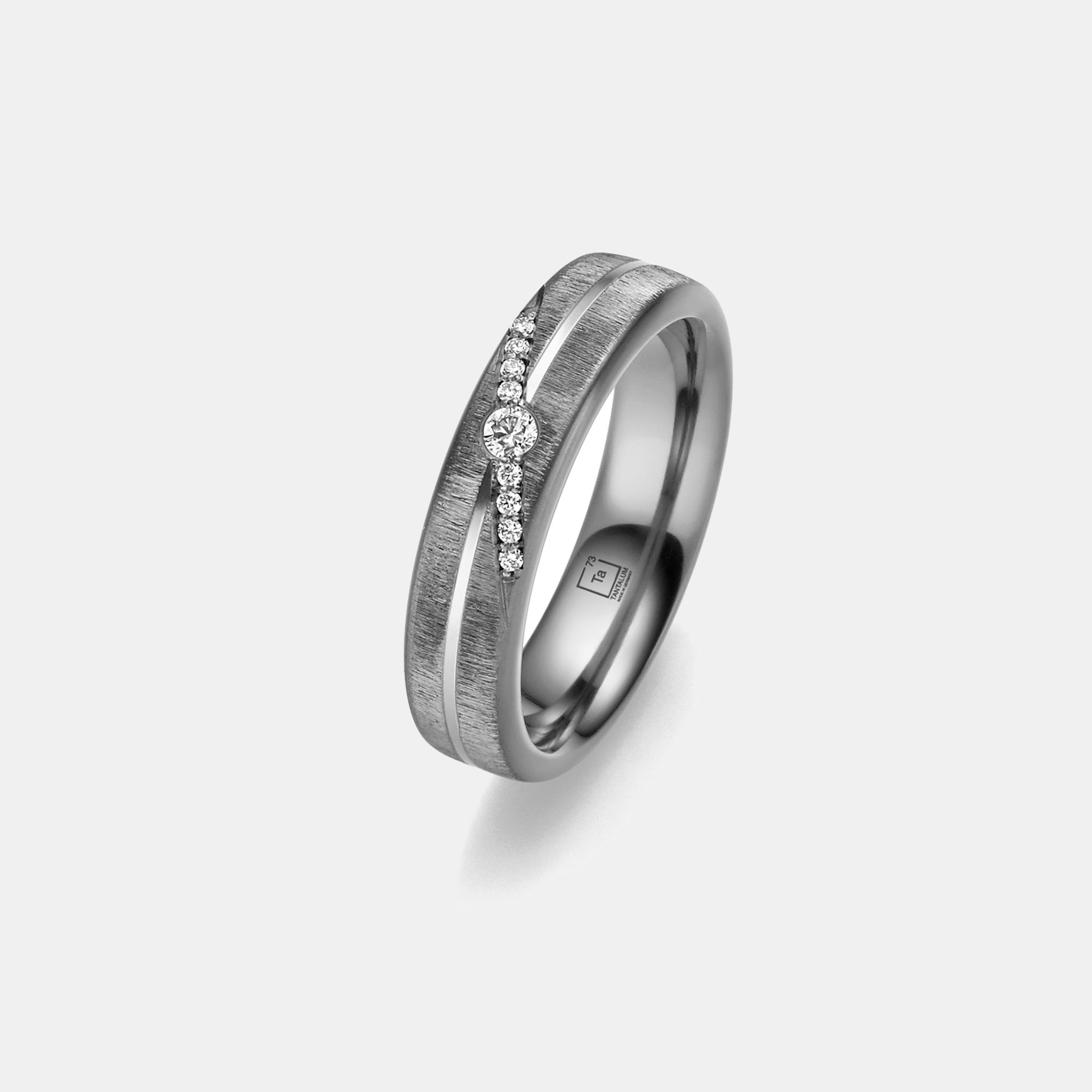 Tantalum wedding ring with a diagonal diamond row design