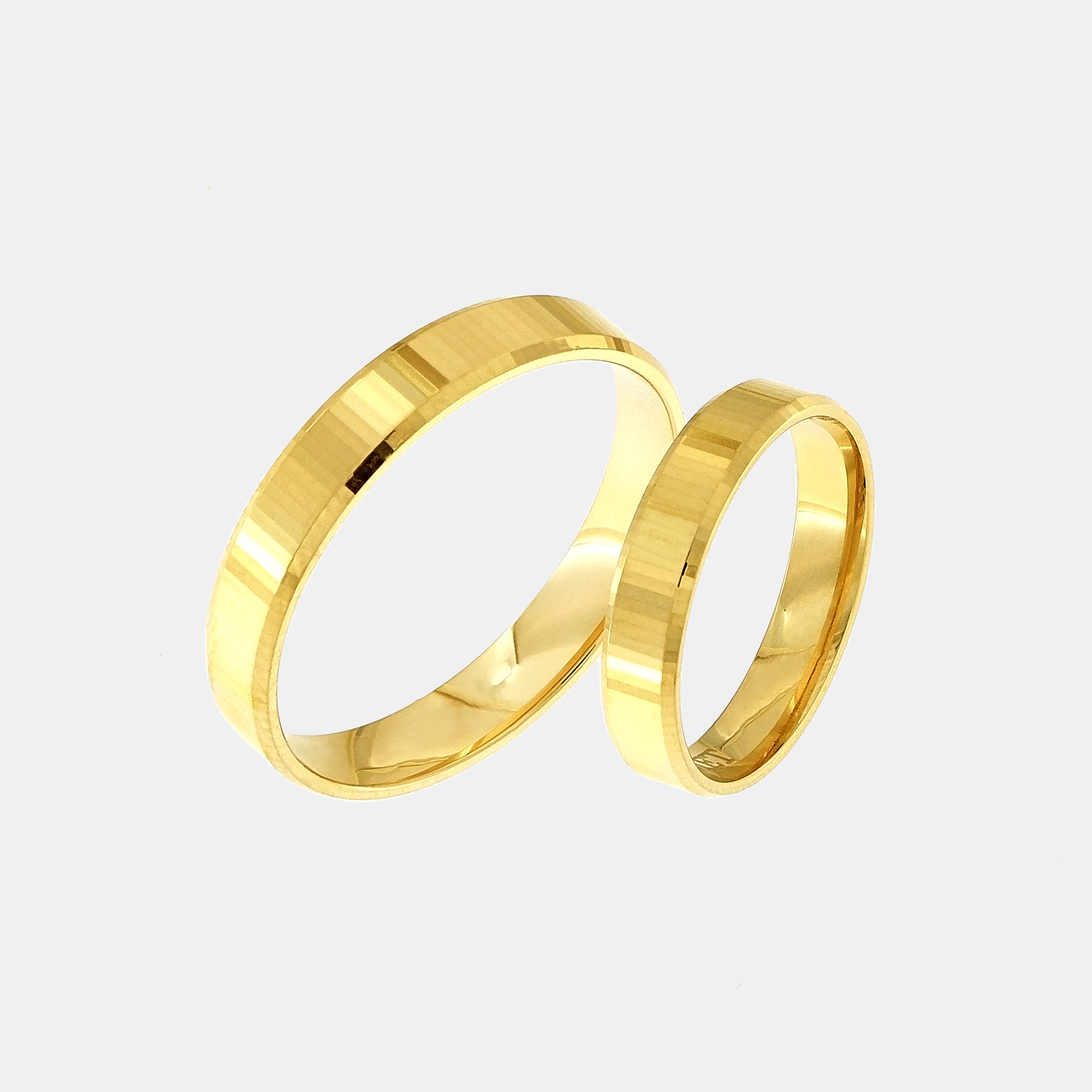 Gold wedding rings with a linear textured pattern